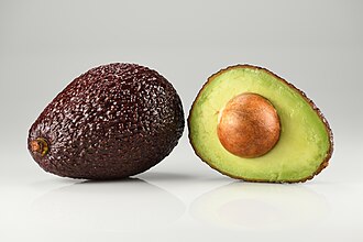 Avocado Hass - single and halved — illustrative photo
